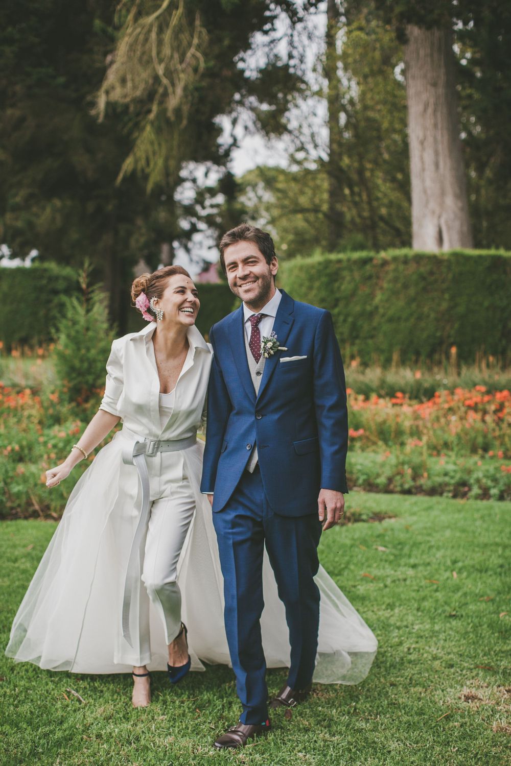 Newlyweds walking on the grass