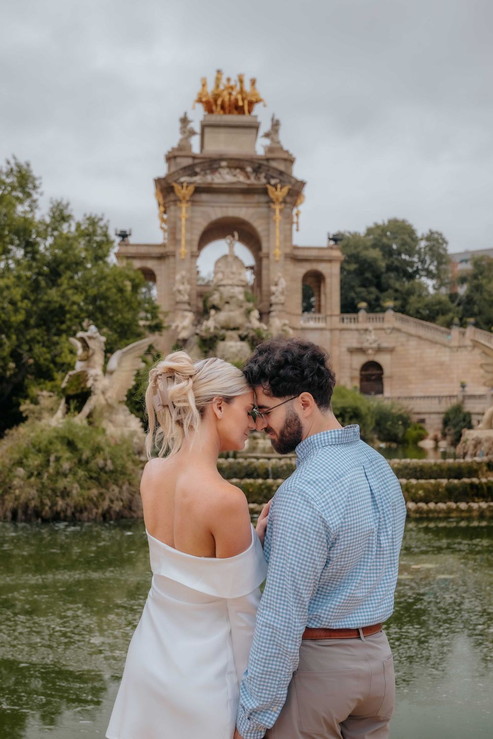 Bailey and Neil standing on the steps of the park fountain.