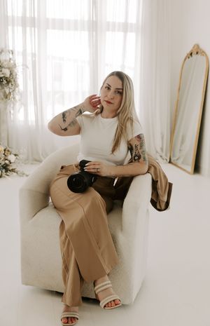 Lifestyle photography session featuring casual poses on white furniture with modern minimal styling.