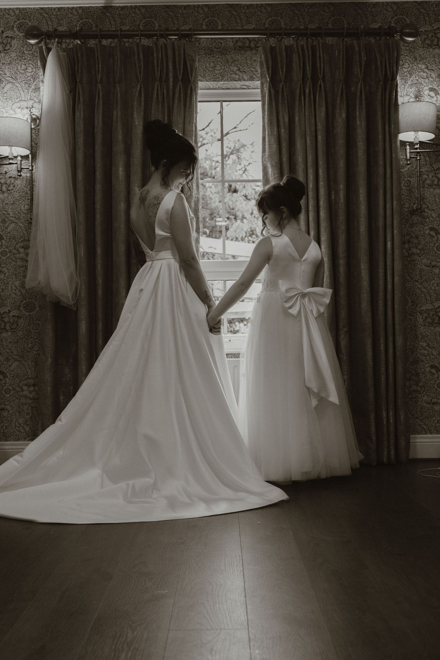 Bride and daughter by the window at Corick House, Co. Tyrone
