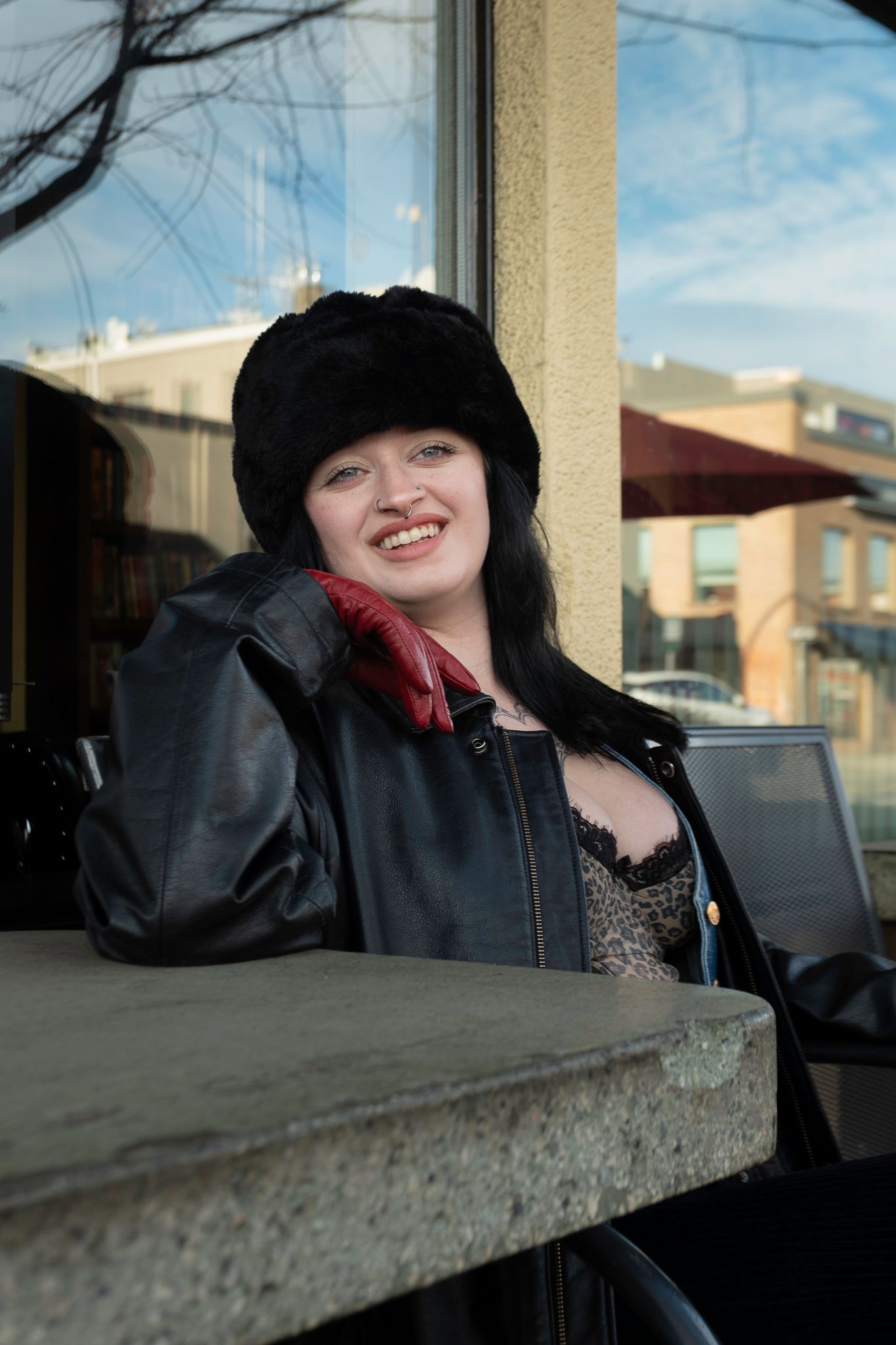 Dramatic black and white portrait series featuring red lipstick and dark clothing against a shadowy background.