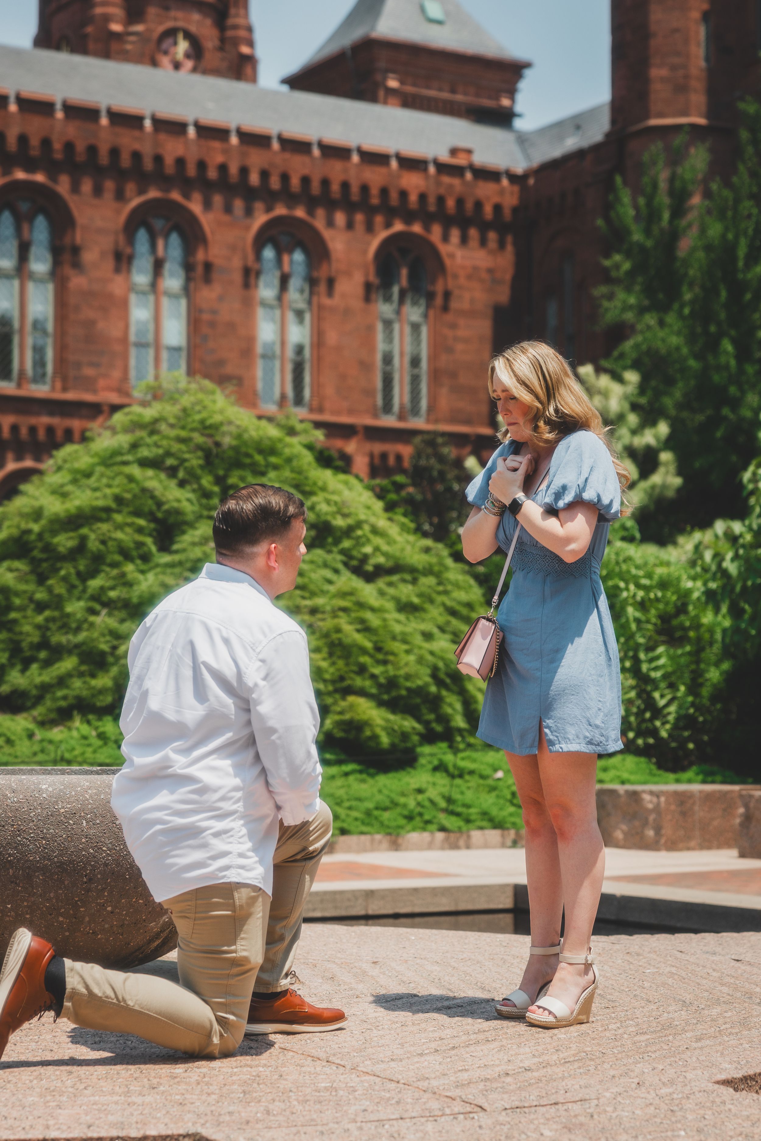 A marriage proposal sequence showing multiple angles of a couple on the steps of a historic brick building at Enid Haupt