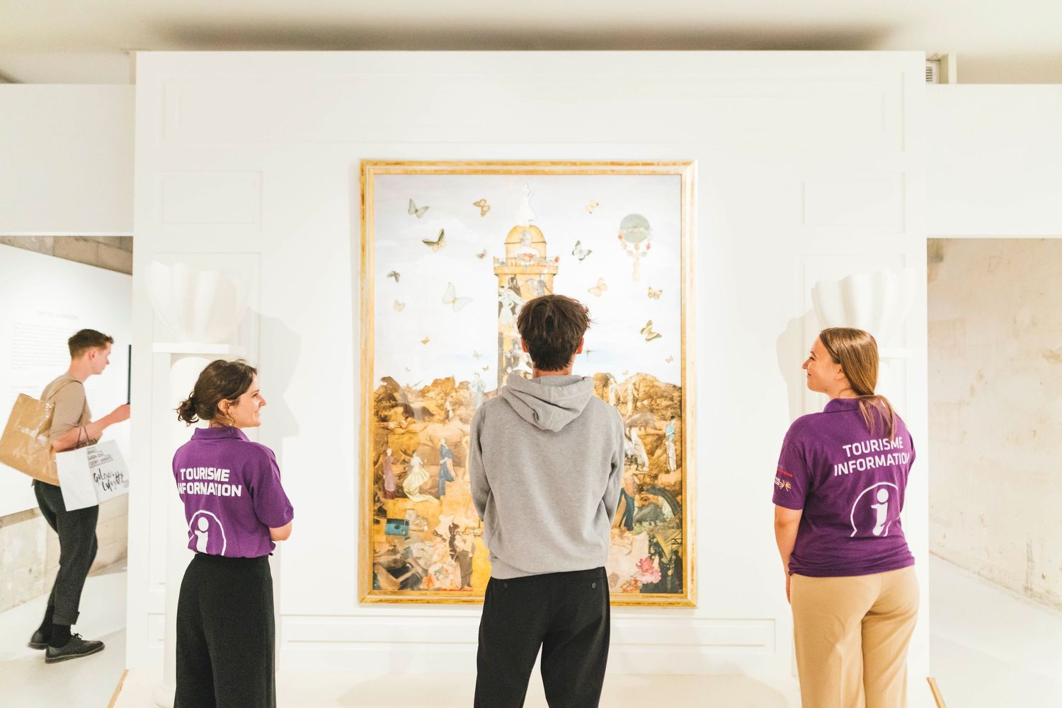 People viewing artwork in a gallery shown in a series of connected photos displayed horizontally.