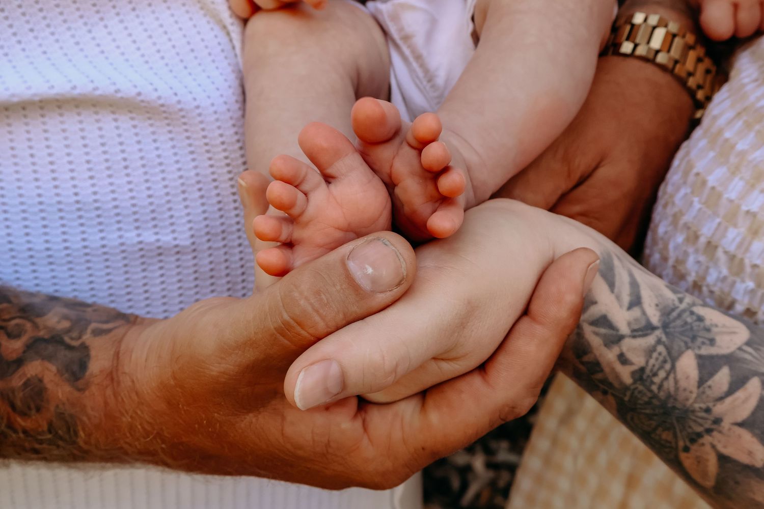 Relaxed lifestyle newborn photography telling the story of life with a new baby, just as it is.