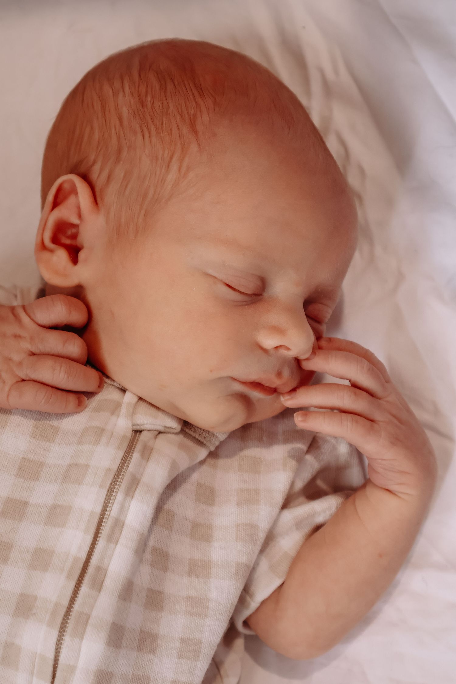 Relaxed lifestyle newborn photography telling the story of life with a new baby, just as it is.