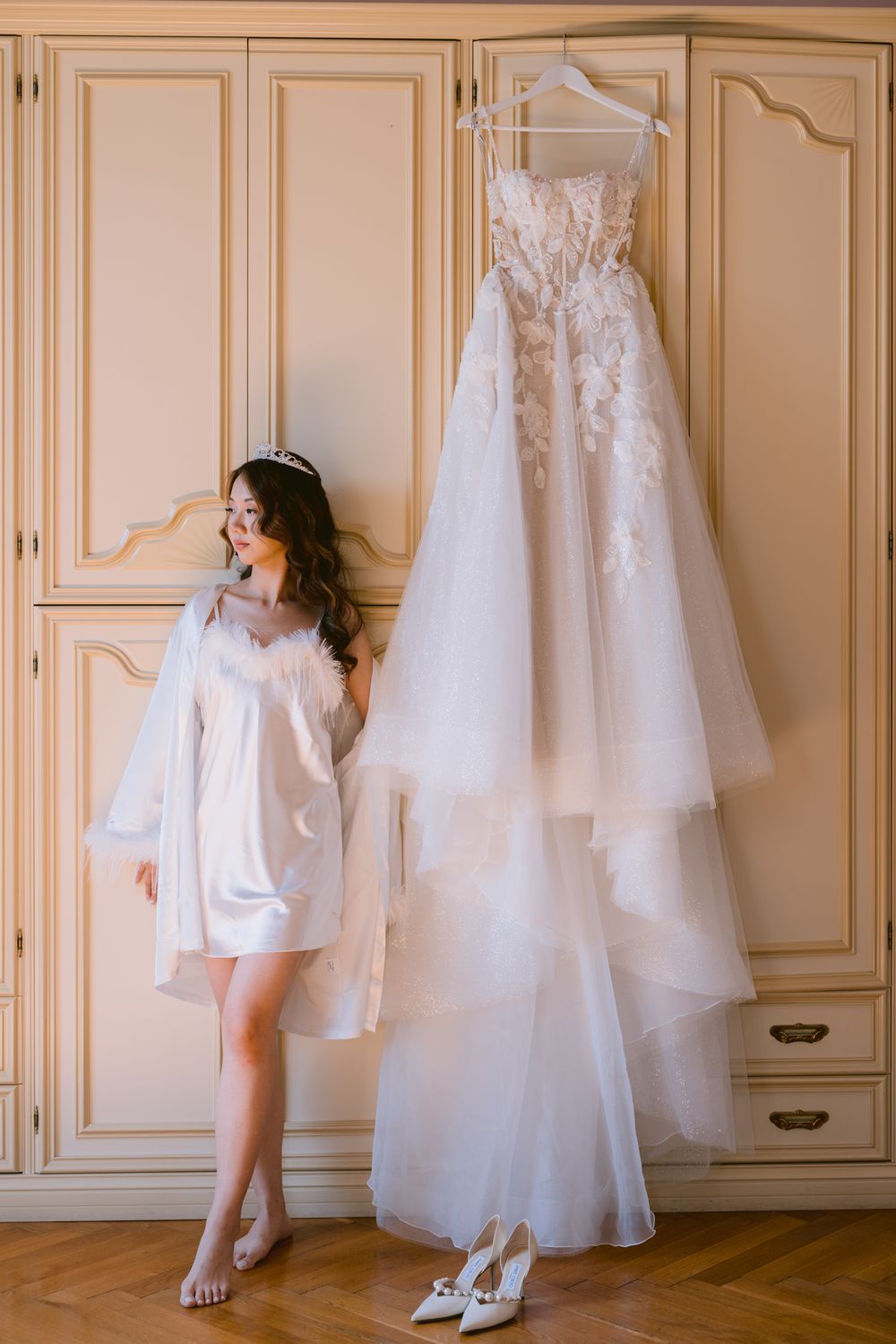 A series of wedding preparation photos showing white gowns hanging in a room and elegant bridal shoes on the floor.