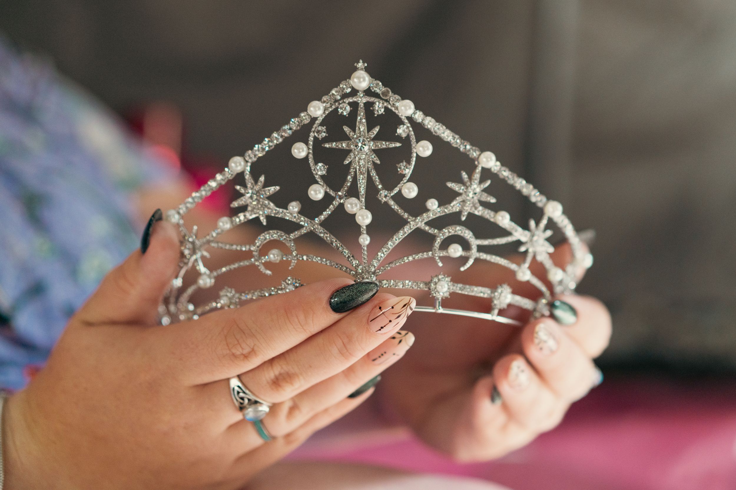 A sparkling silver tiara with delicate designs, wedding details captured by Savvy Photography - Seattle Wedding Photographer