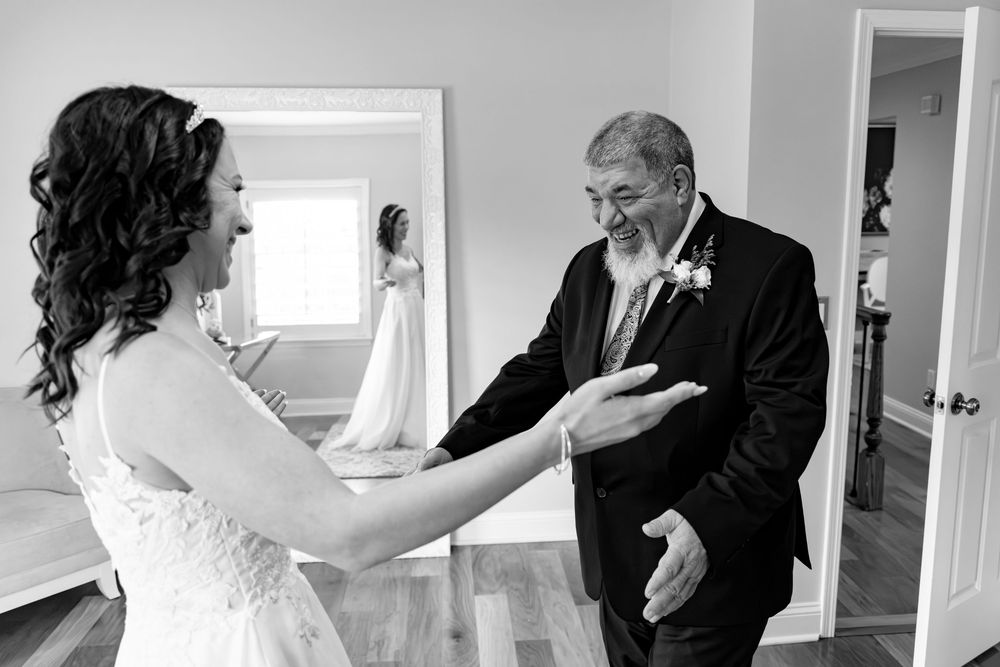 Black and white photos capturing emotional first look moments between family members at a wedding.