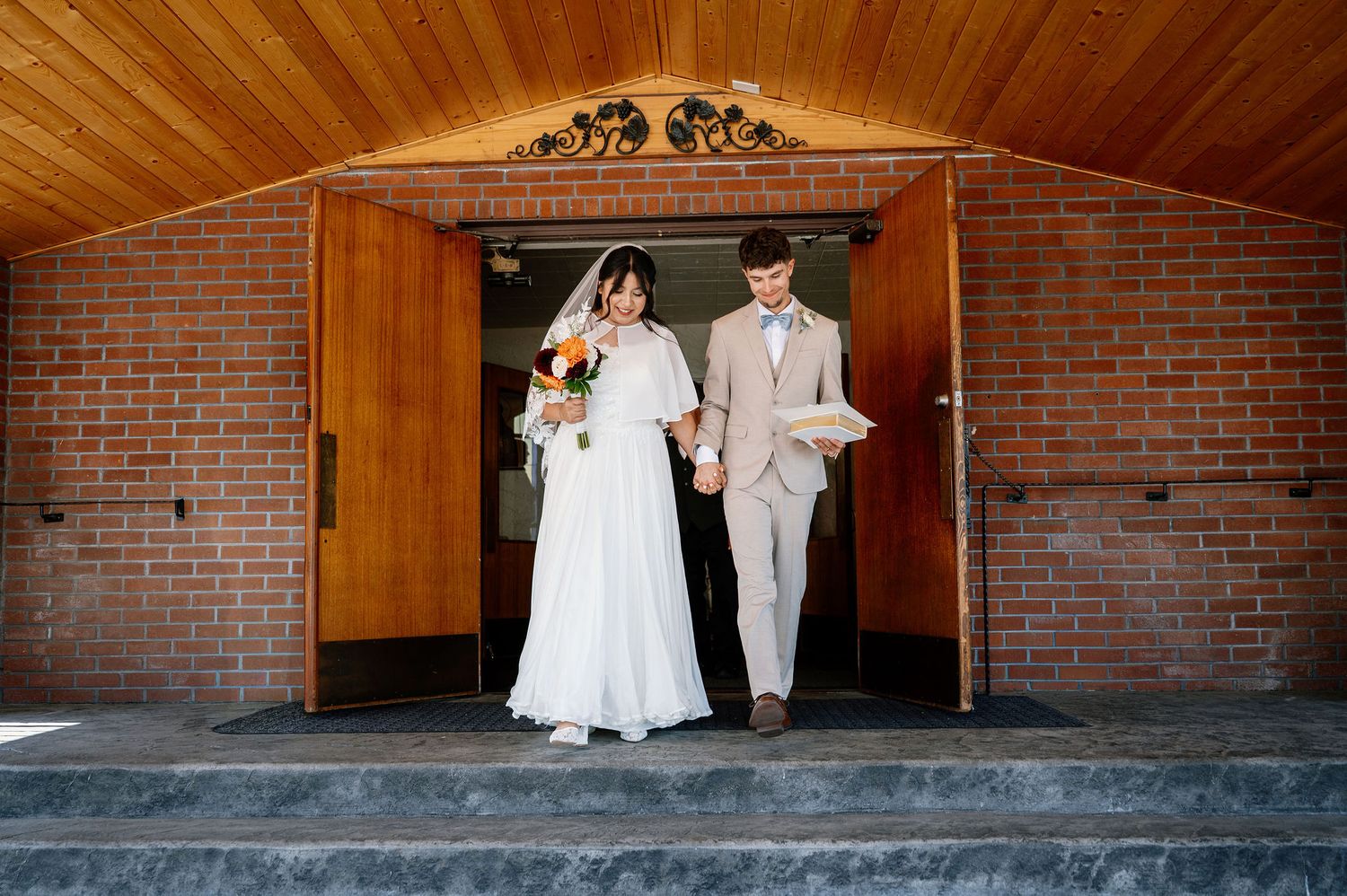 Bride and groom exit their Catholic Church wedding ceremony in Oregon