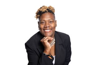 Three headshots showing the same person wearing a black blazer and jewelry while posing with different expressions.