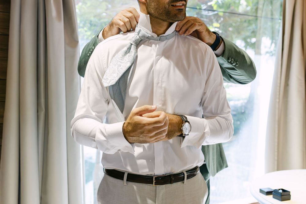 Intimate moment between groom and nephews before ceremony