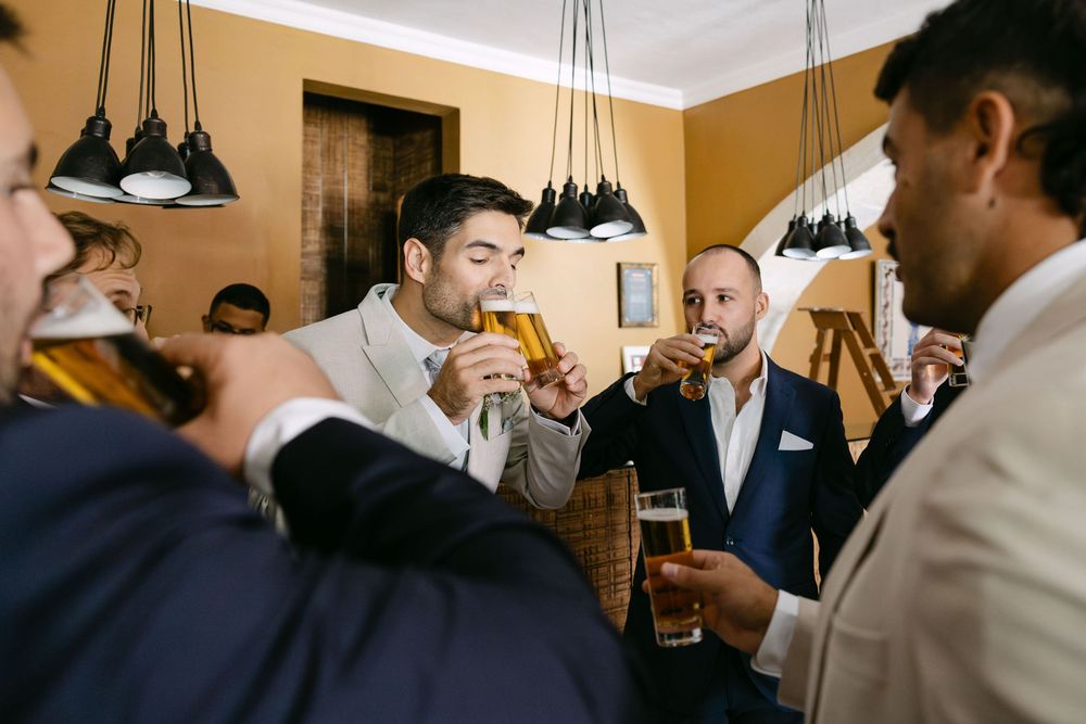 Friends celebrating with groom before Quinta da Bichinha wedding