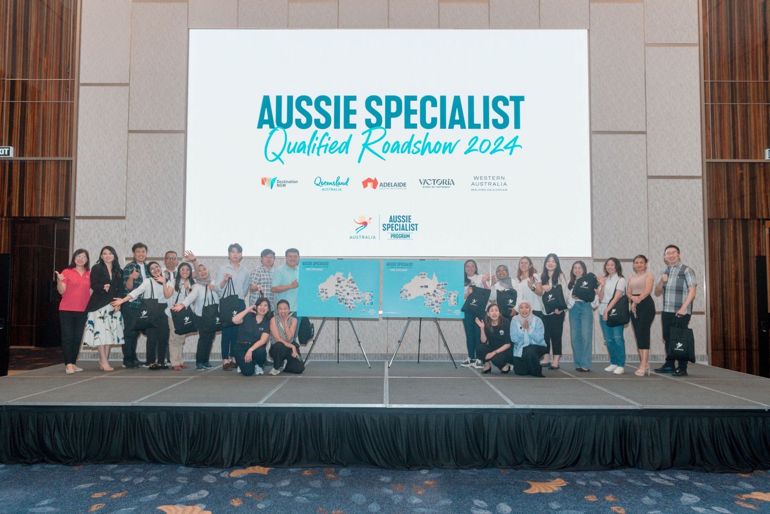Large group photo of business professionals posing together at an Aussie Specialist event.