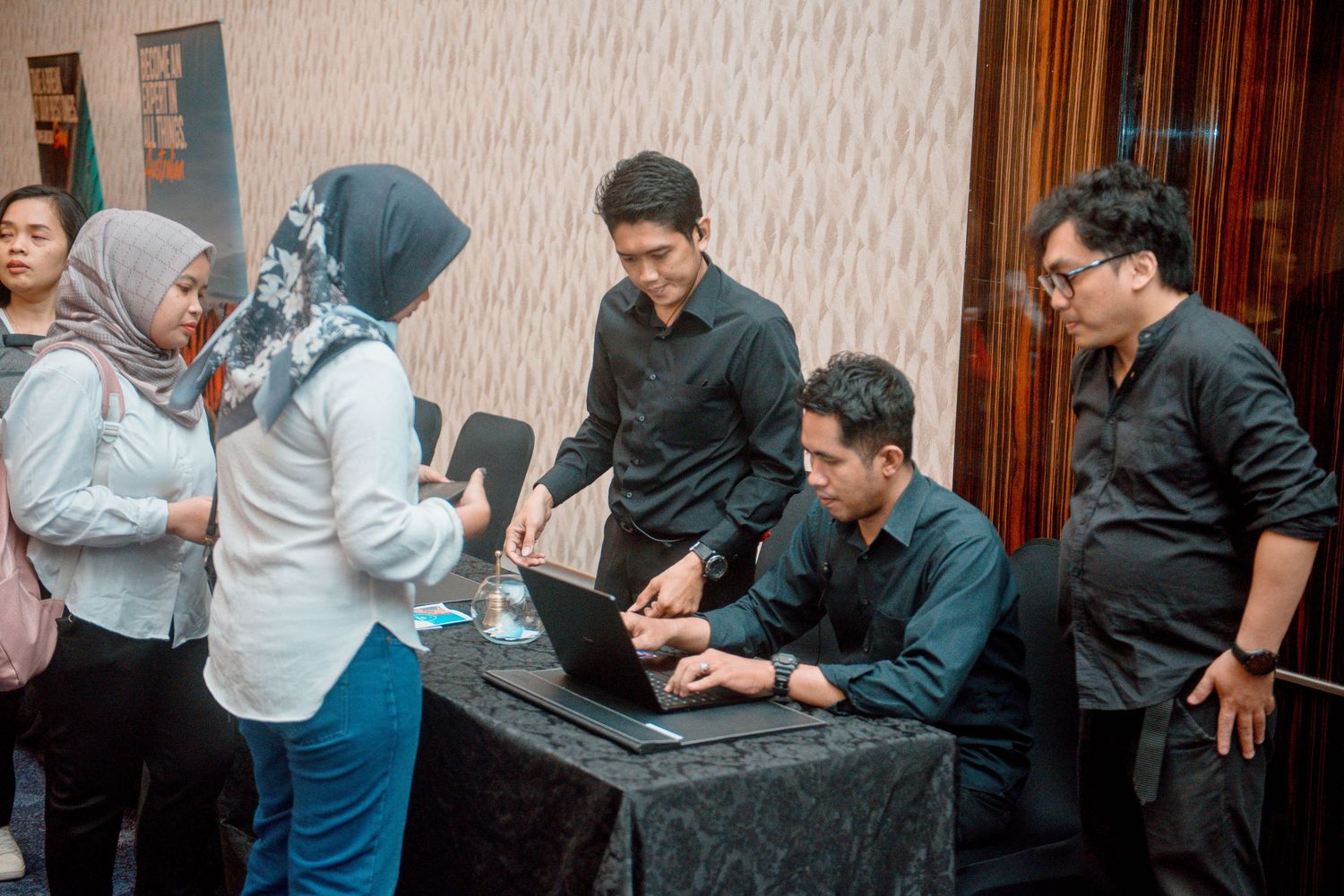 A sequence of candid moments showing people interacting and laughing together at a social gathering.