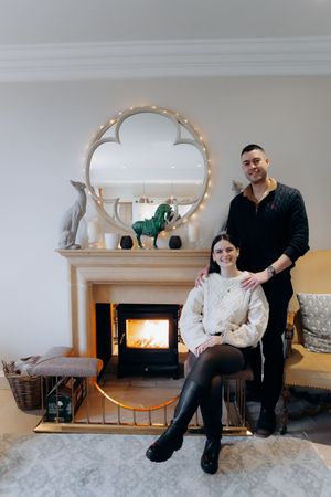 A series of casual photos showing people sitting and interacting on a couch in front of a fireplace.