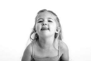 Close-up back and white portrait showing joyful expressions and laughter.