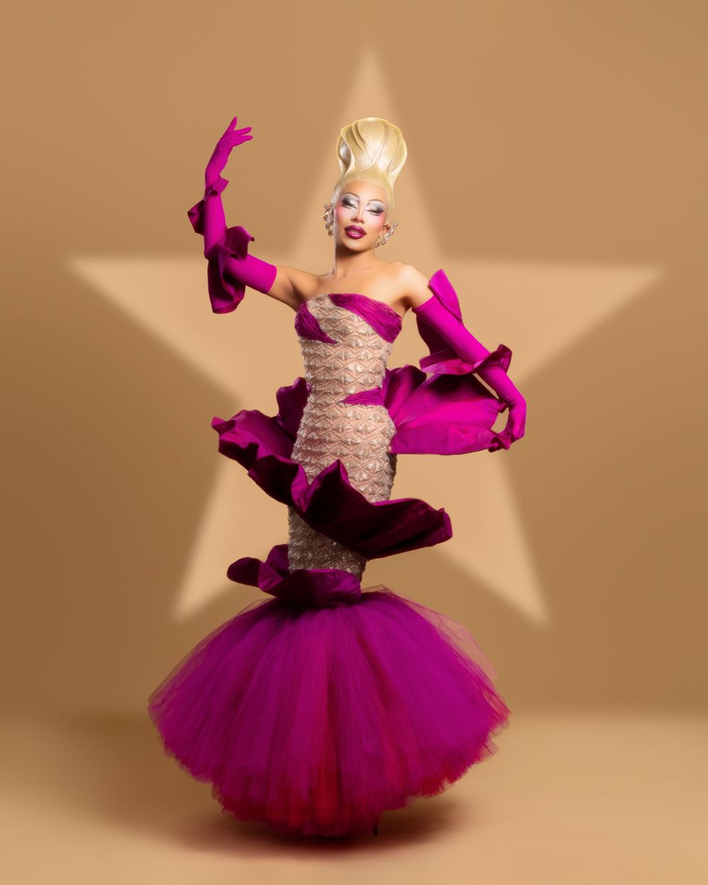 Dancer in a magenta tulle dress and white corset performs a dynamic sequence of twirling poses against a beige backdrop.