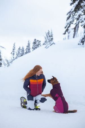 German Shepard and Owner enjoying a snowy hike in Washington