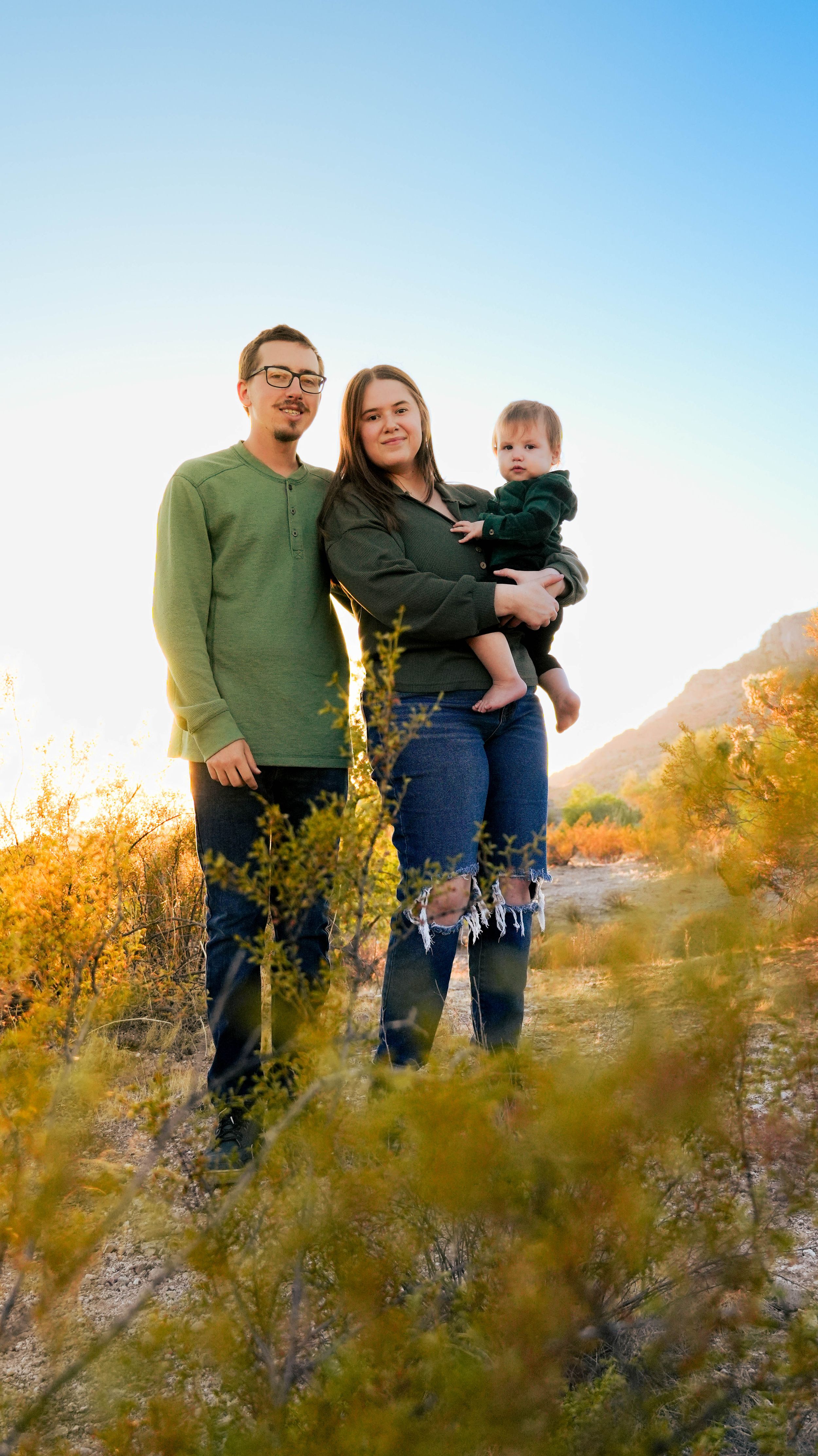 A dad twirling his daughter for a family photography session in San Tan Regional Park, Arizona with Samantha Stickroth Photography.