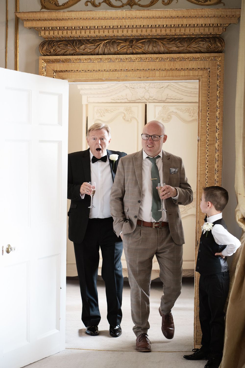 A sequence of four photos showing people in formal attire walking through an elegant doorway in a grand interior space.