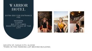 Woman poses on rooftop with city views at the modern, classy Warrior Hotel in Sioux City, IA.