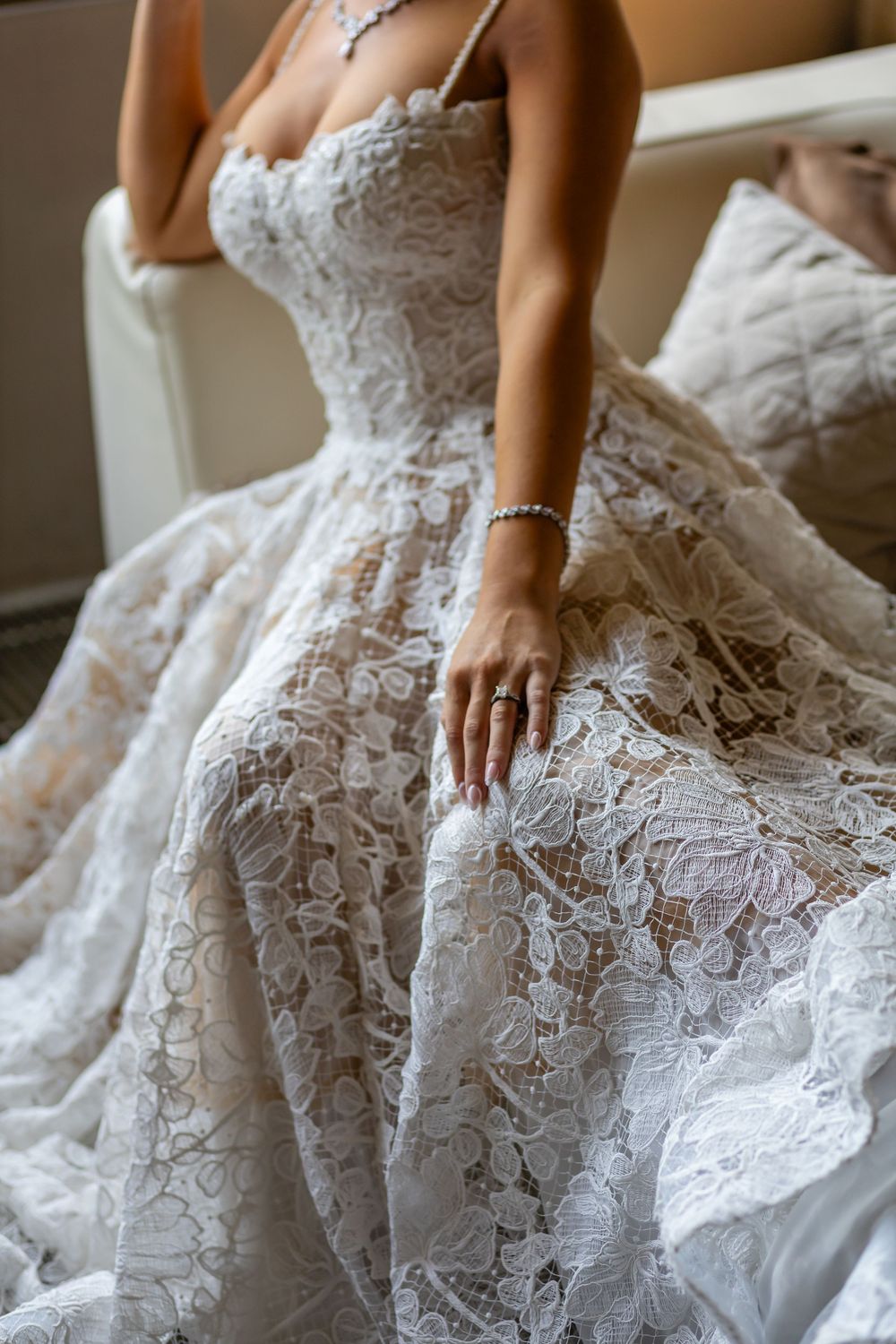 Stunning lace wedding gown by Atelieria captured in the gardens of Assisi.