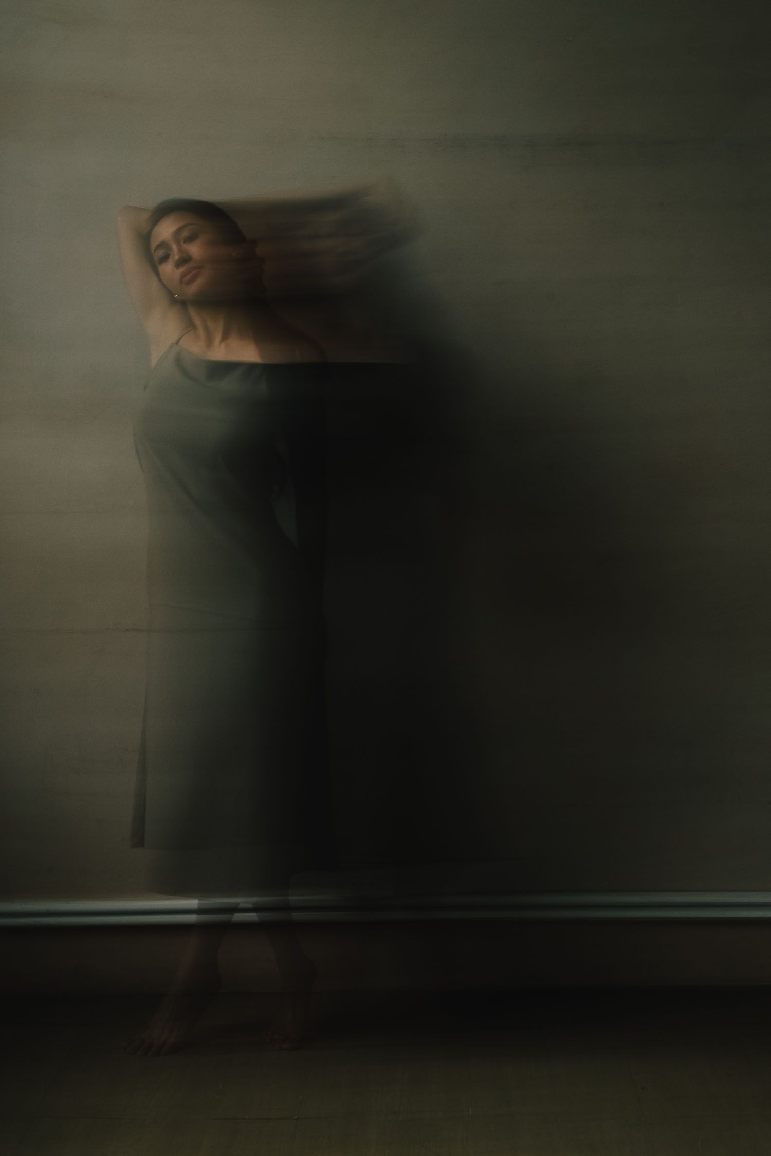A series of dark, moody abstract photographs with blurred motion effects creating an atmospheric and haunting mood.