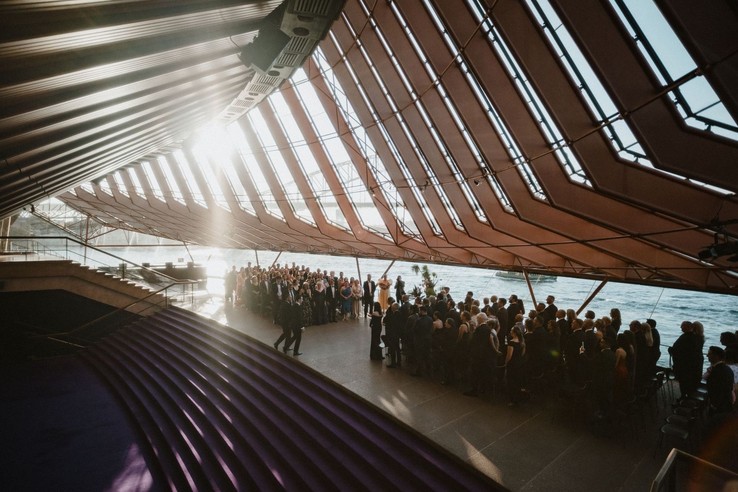 An architectural interior shot of a modern venue with dramatic angular ceiling and natural light.