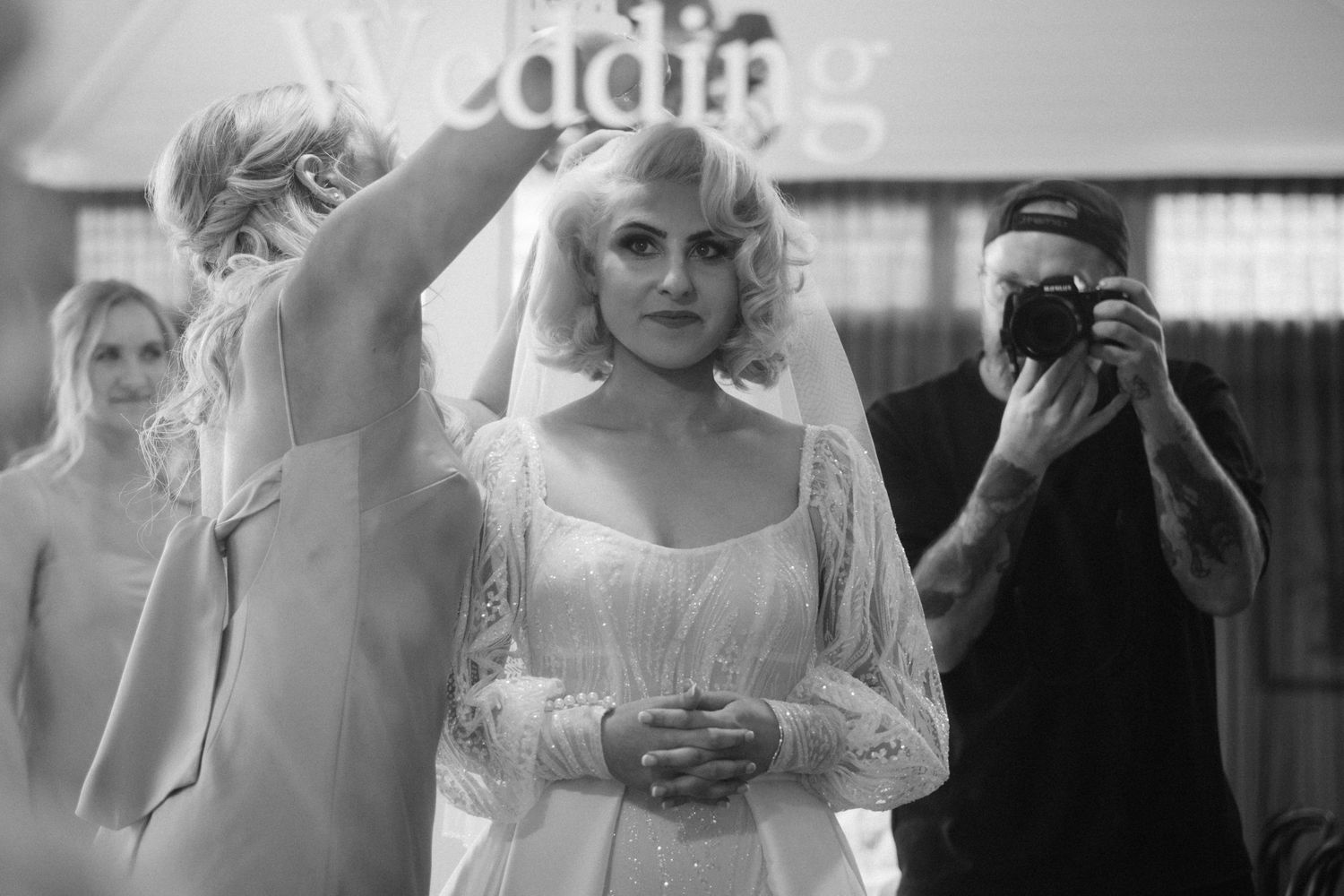Black and white candid moments from vintage-style wedding celebration.