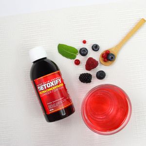supplement with berries and red drink ultra concentrated formula for cleansing, energy, and wellness, product photography for catalogue