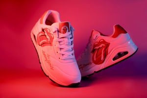 Skechers x Rolling Stones white sneakers with tongue logo bold streetwear collab in vibrant lighting, product shoes photography, Spain, EU