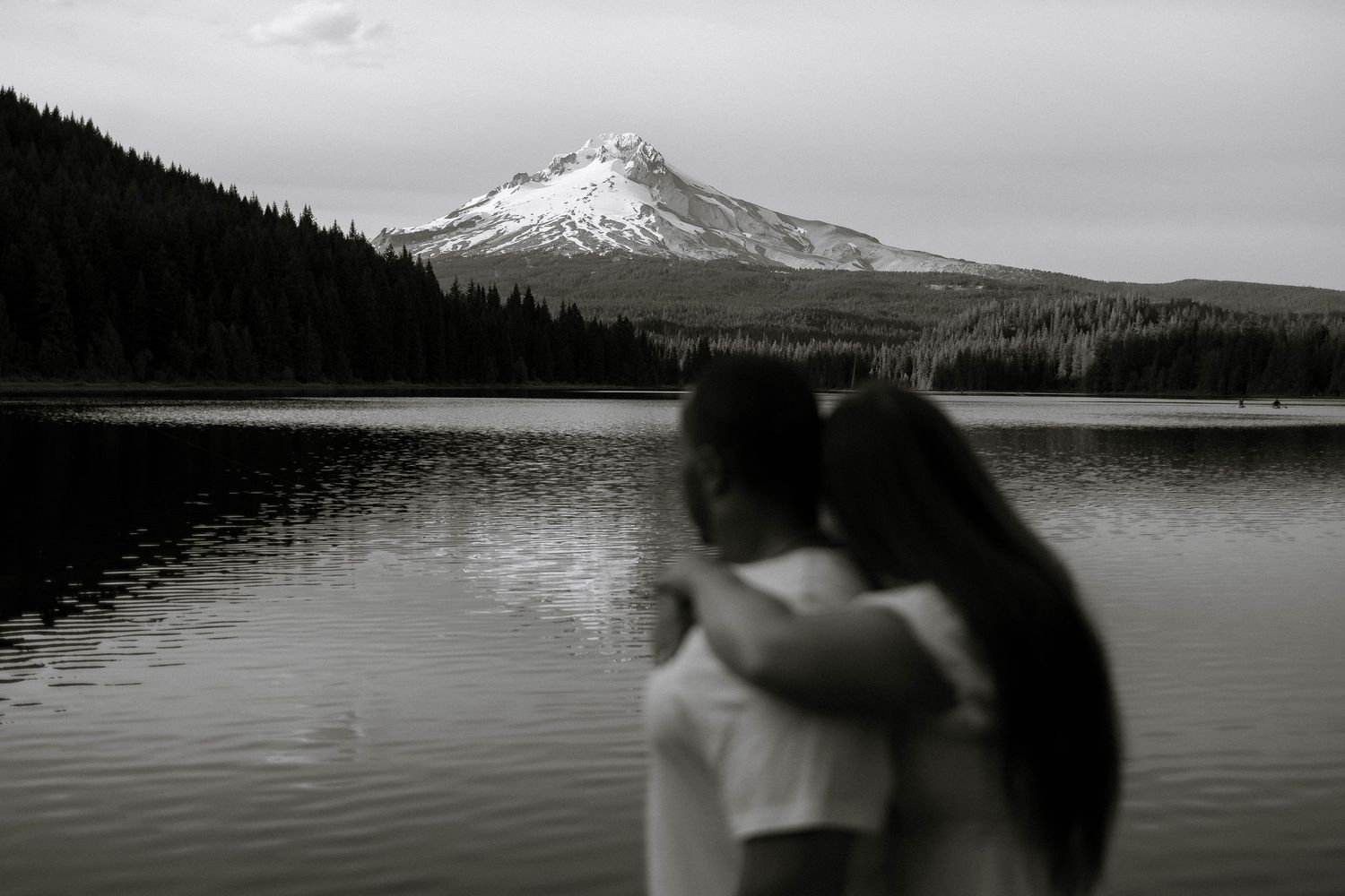 Couples smiling at eachother on their wedding day, forehead to forehead.