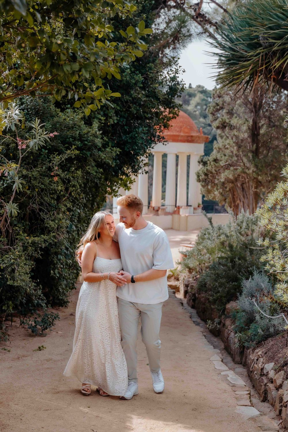 Riley looking at Valentina with love in a botanical paradise.