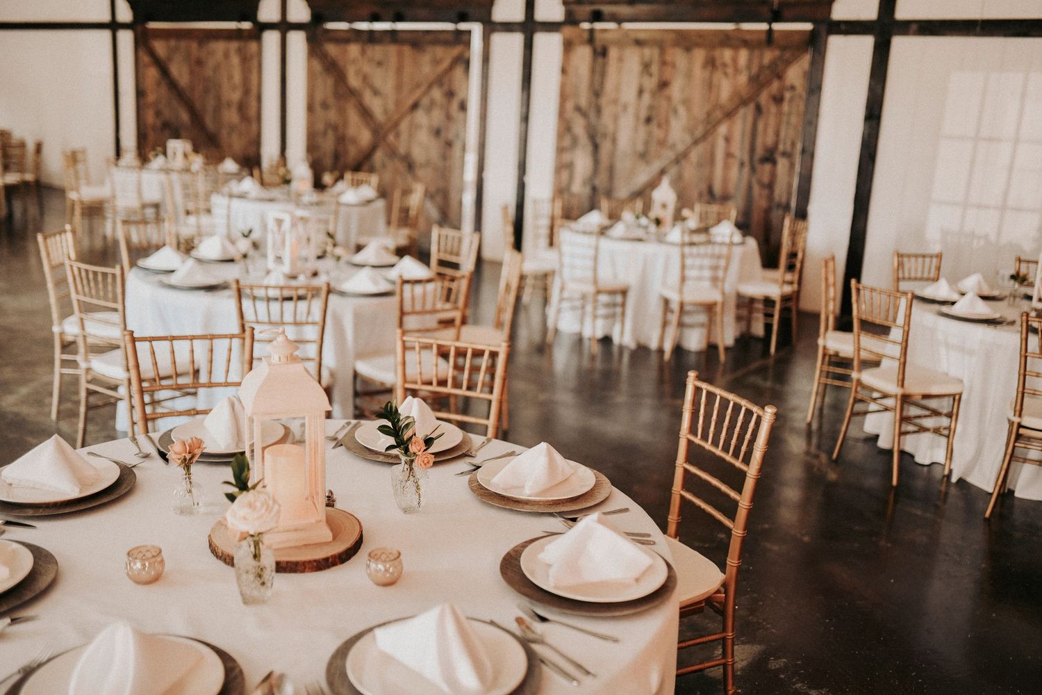 Pink florals and loose greenery styled in a romantic spring wedding reception