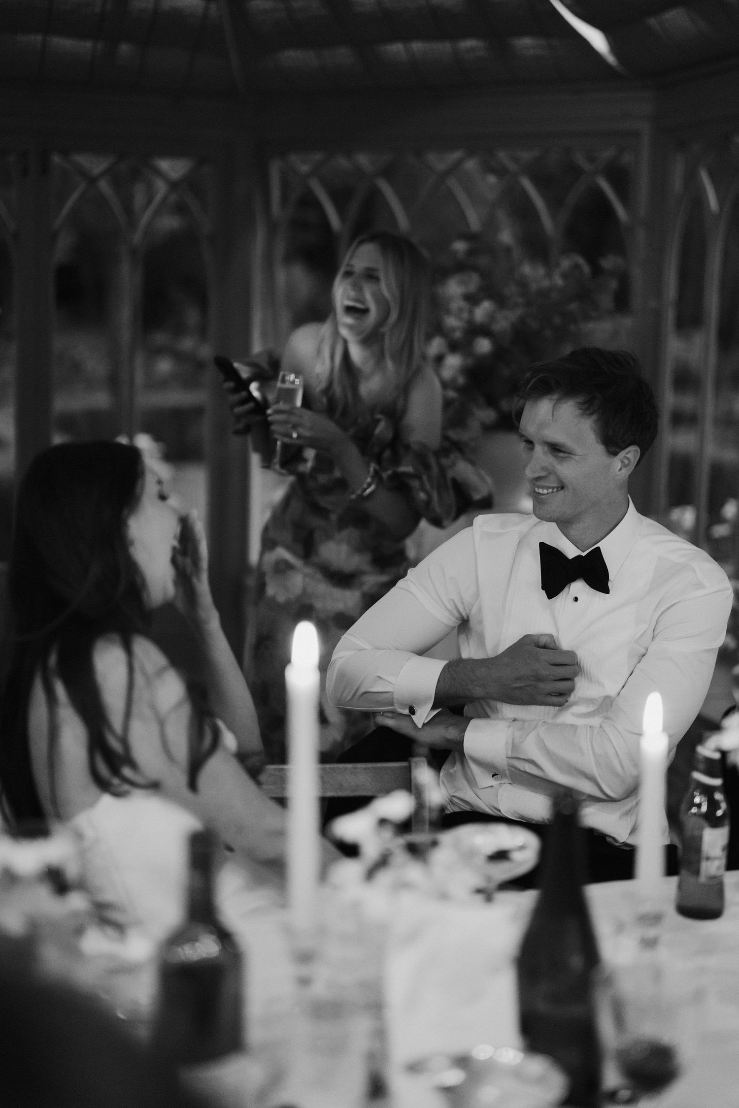 brides friend giving a speech about the bride as the friend, bride and groom all laugh at dewsall court in herefordshire