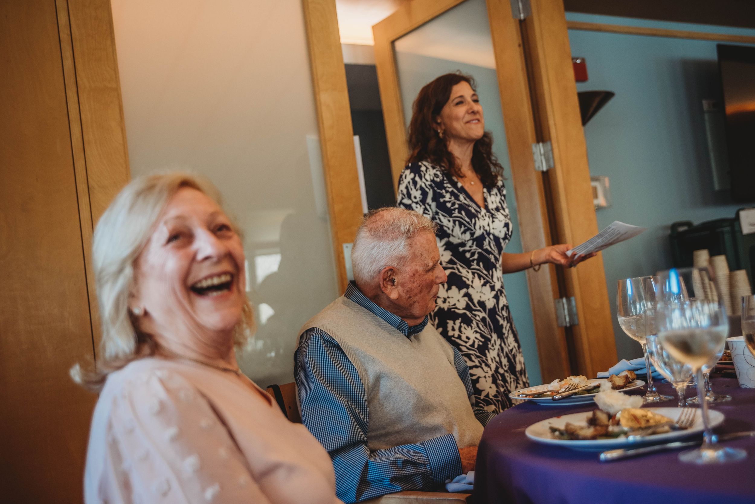 A sequence of photos showing people laughing and enjoying themselves at a gathering with warm lighting.