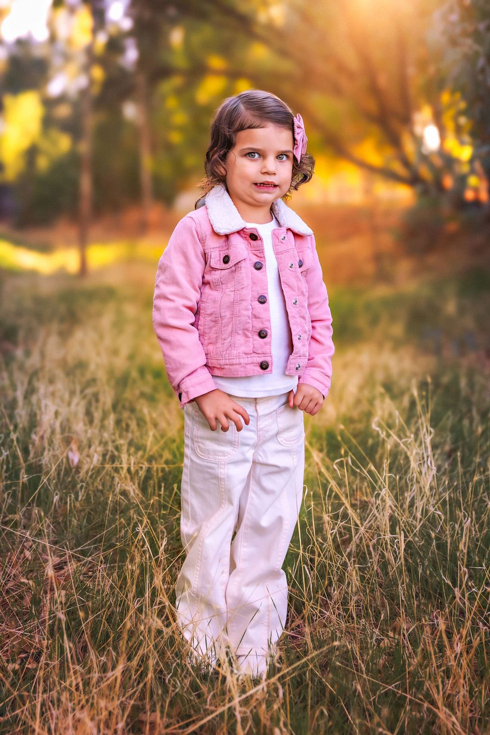 Fresno-based photographer capturing cozy fall family moments in Clovis trail at sunset.