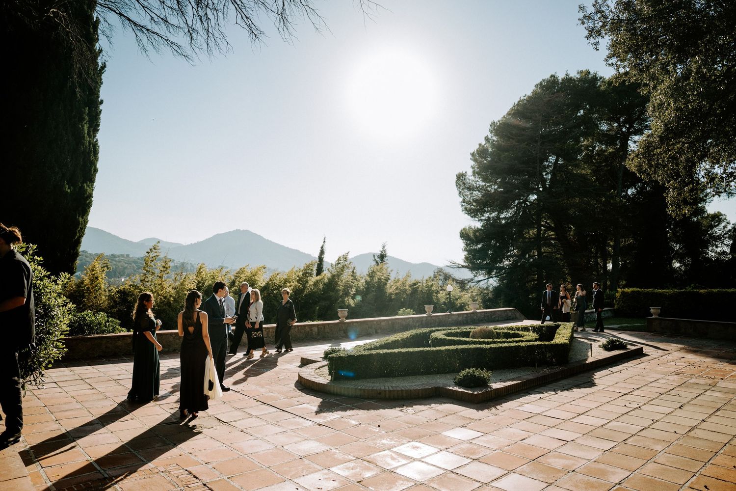 Scenic mountain vista view through stone archways at an outdoor wedding venue.