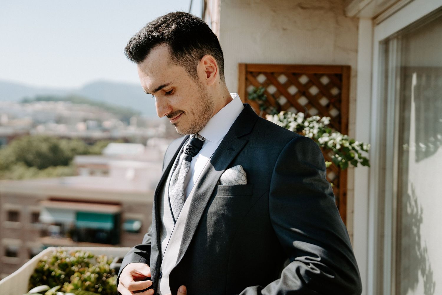 Elegant wedding preparation moments captured in natural window light.