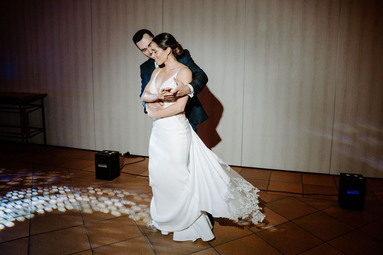 Artistic black and white dance sequence on a wooden floor showing flowing movement.