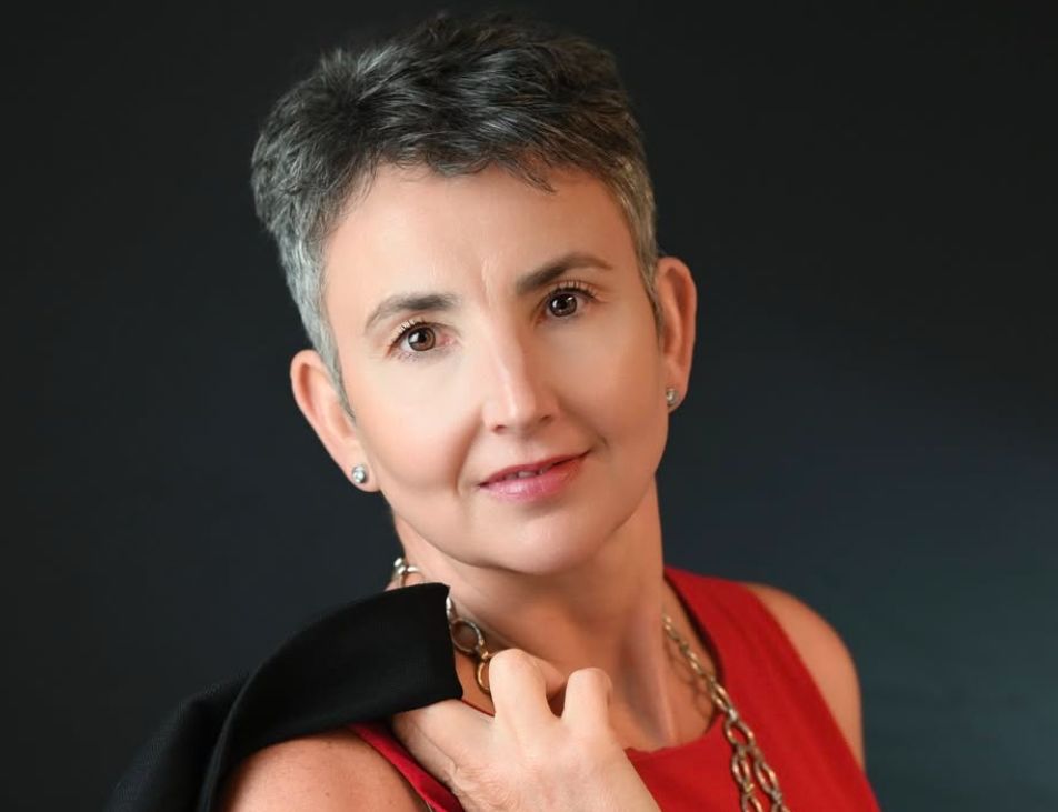 A series of professional headshots showing someone wearing a red top against a dark background.