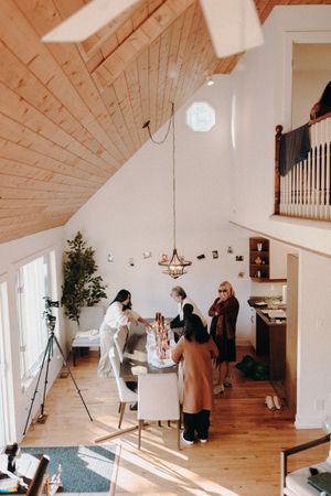 Bright modern wedding venue with vaulted wooden ceiling and natural light.