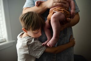Memphis Family Portrait of mother, newborn and son during Day in the Life session in Memphis Tennessee.