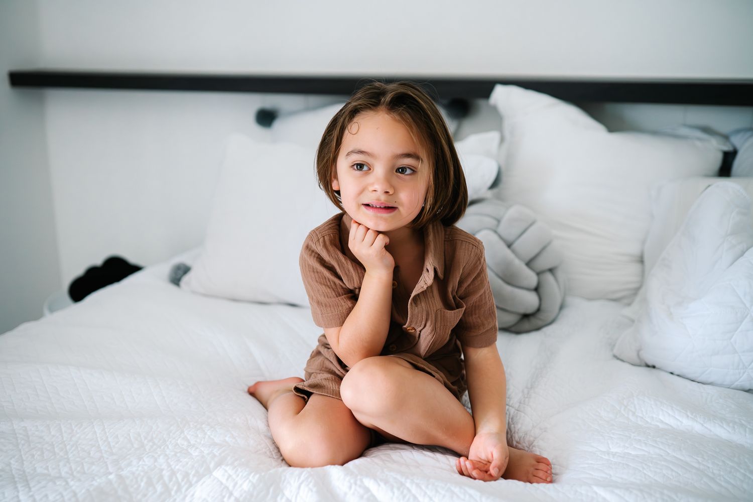 Elder brother posing during a newborn and family photoshoot at home by Melbourne newborn and family photographer Pei A Photography