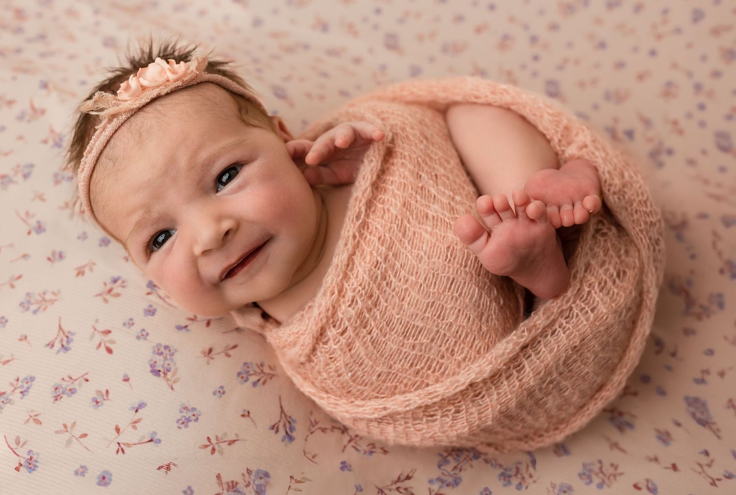 Charlottesville photographer, newborn, maternity, family, baby, newborn girl on floral backdrop with eyes open and pink knit wrap