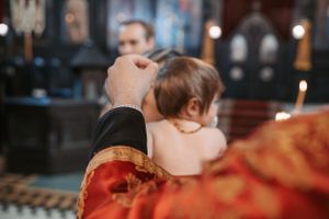 Sacred moments of a religious ceremony inside a historic church with traditional decorations.
