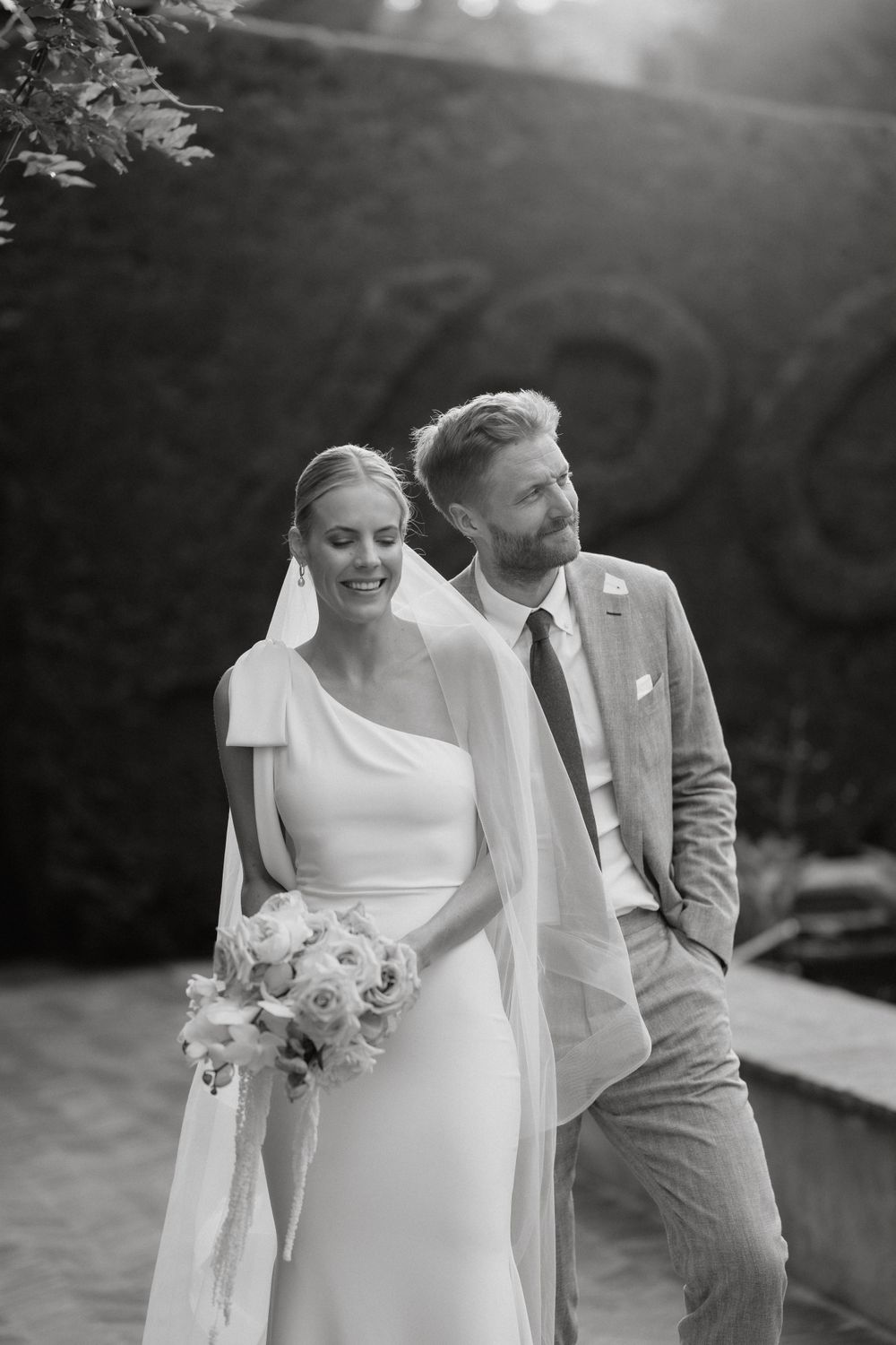 Black and white wedding portrait with elegant minimalist styling.