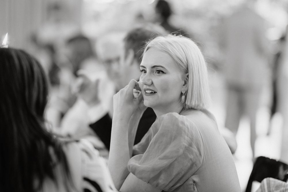 Black and white photo of guest at formal dinner event.