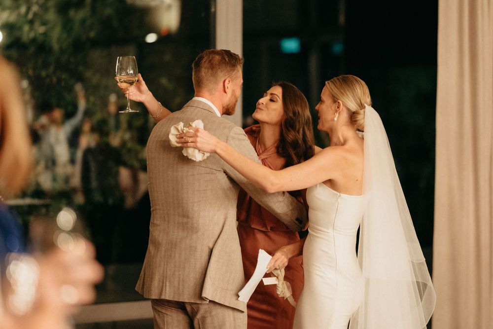 Wedding celebration dancing moment captured during evening reception.