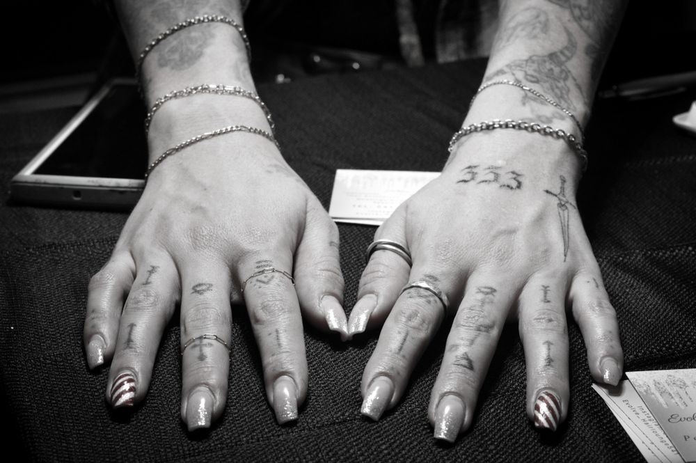 Tattooed hands and jewelry